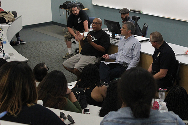 Skipp Townsend, former gang member, adresses students about police brutality at the Social Justice Panel on Sept. 29 in S201. Dr. Haas, History professor hosted the event.