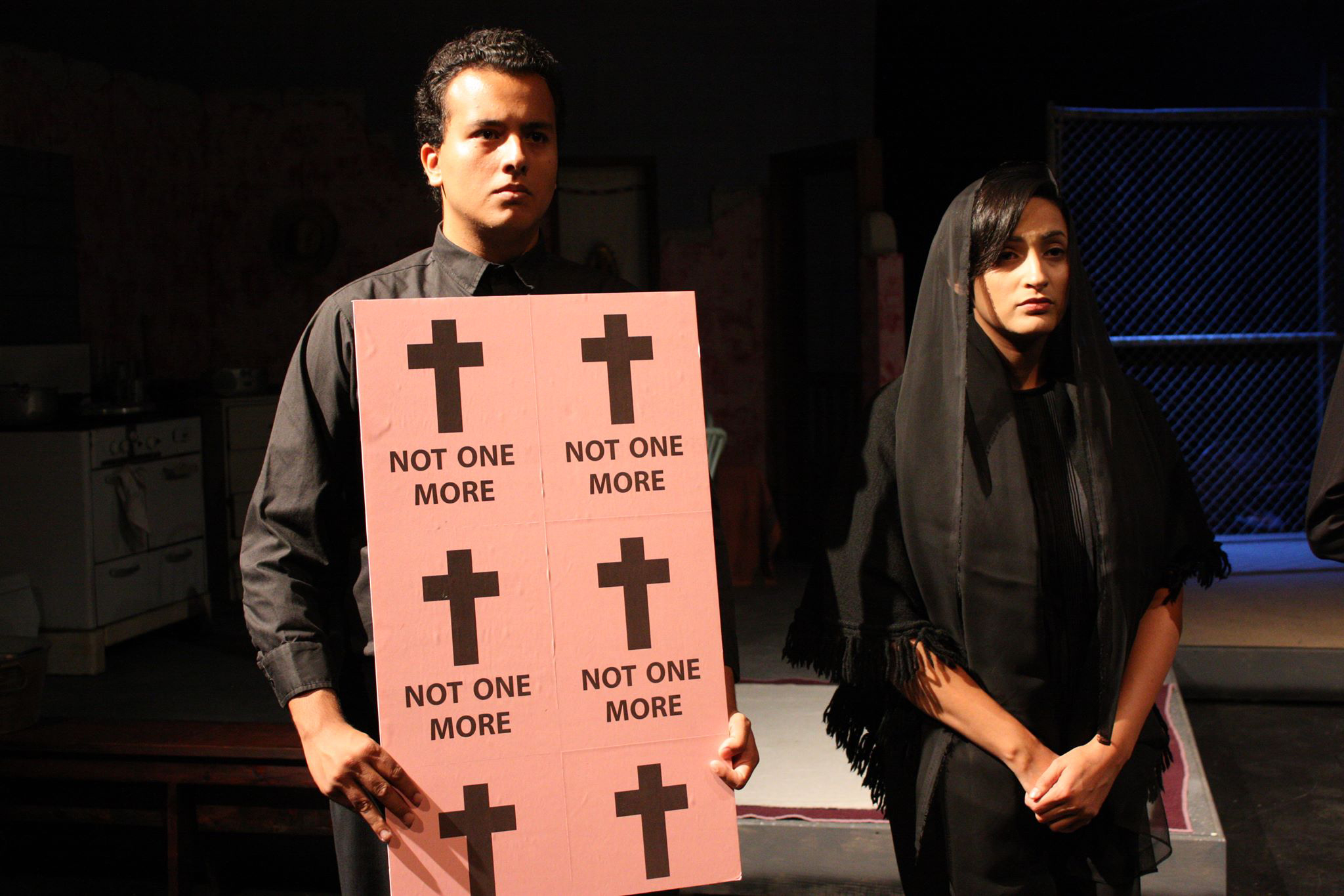 Dempsey Garcia and Angelica Montoya mourn the disappearance of hundreds of women in Juarez in the Women of Juarez play.