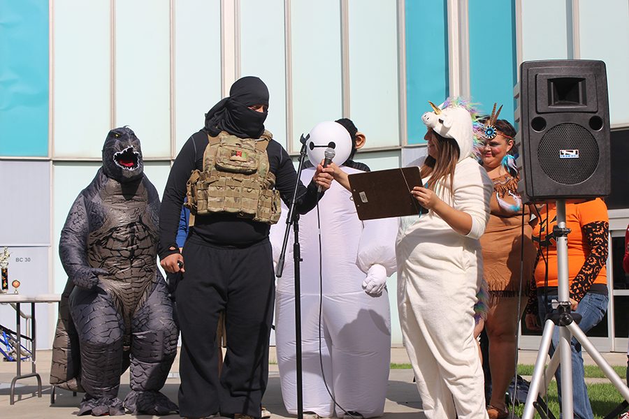 Enrique Rueda dressed as an ISIS terrorist and  Vanessa Vega dressed as a Unicorn for the Cerritos College Halloween costume contest. Once Rueda explained his costume he was disqualified and asked to leave the area. Photo credit: Chantal Romero