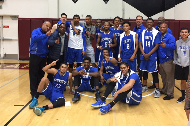The Cerritos College men's basketball team poses after winning the Mt. San Antonio Tournament. The team has won two of the three tournaments it has played in.