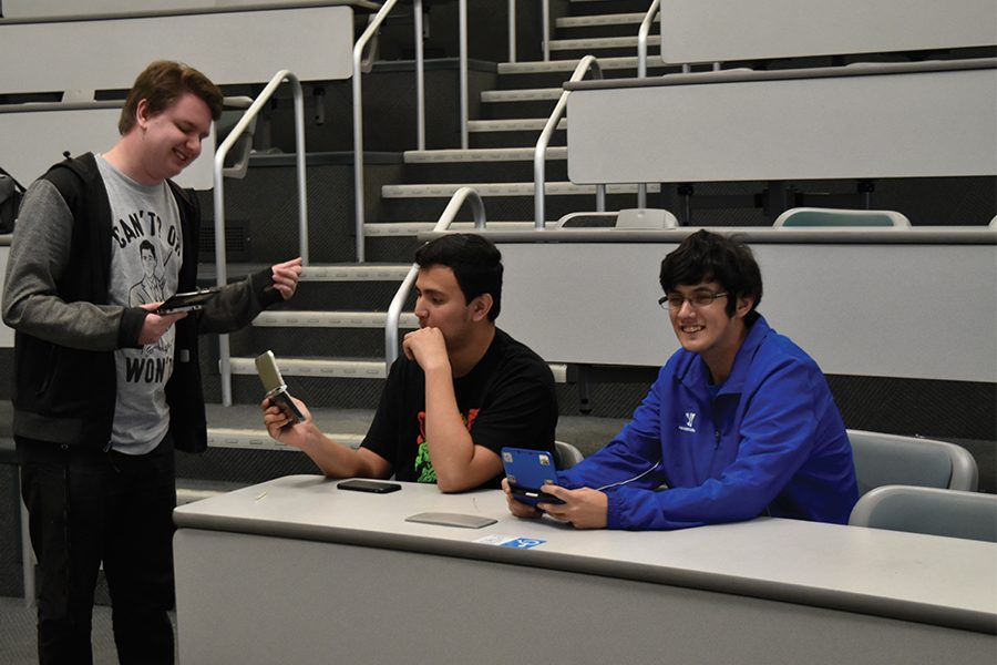 From Left to right, Samuel Schirmer-Grace, Anthony Riestra, and Jovan Orozco, gathered to play Pokémon Sun during the Thursday Dec. 1 Anxiety Gaming Club meeting. The club has 230 registered members with about 15 members that regularly attend the meetings. Photo credit: Perla Lara