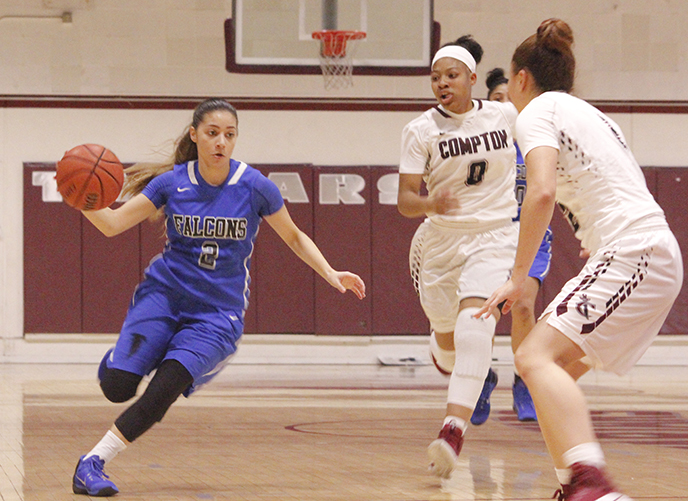 Freshman guard Angie Ferreira attempts to drive past EC-Compton defender. Ferreira would finish with 10 points and three assists in the victory over Compton.