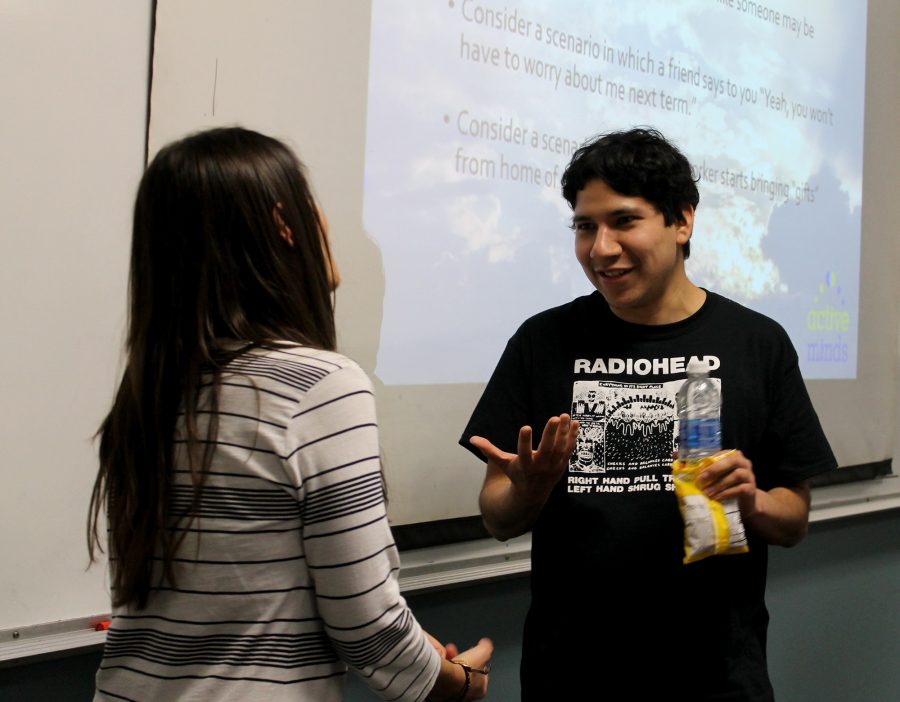 Alumn Ricky Beltran talks to Califronia Program Manager for Active Minds Becky Fein. Beltram stated that he knew Fein had a great understanding of suicide prevention and that was his reason for attending the event. Photo credit: Benjamin Garcia