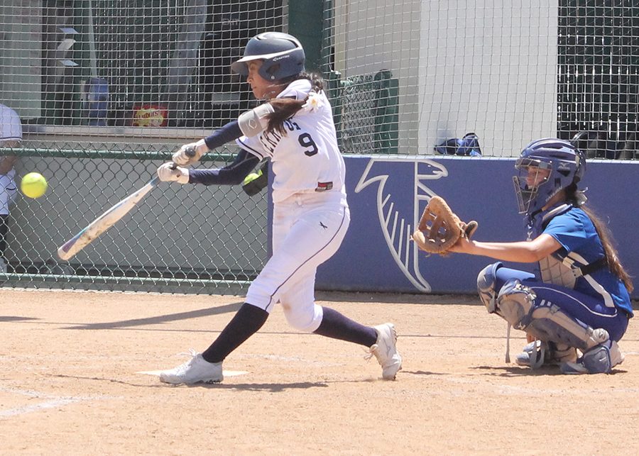 Starting outfielder Kimberly Olivas send a ball to center field during the fifth inning of the Falcons game with Santiago Canyon Saturday, April 22. Olivas is leading the team with 17 steals on the season. Photo credit: Max Perez