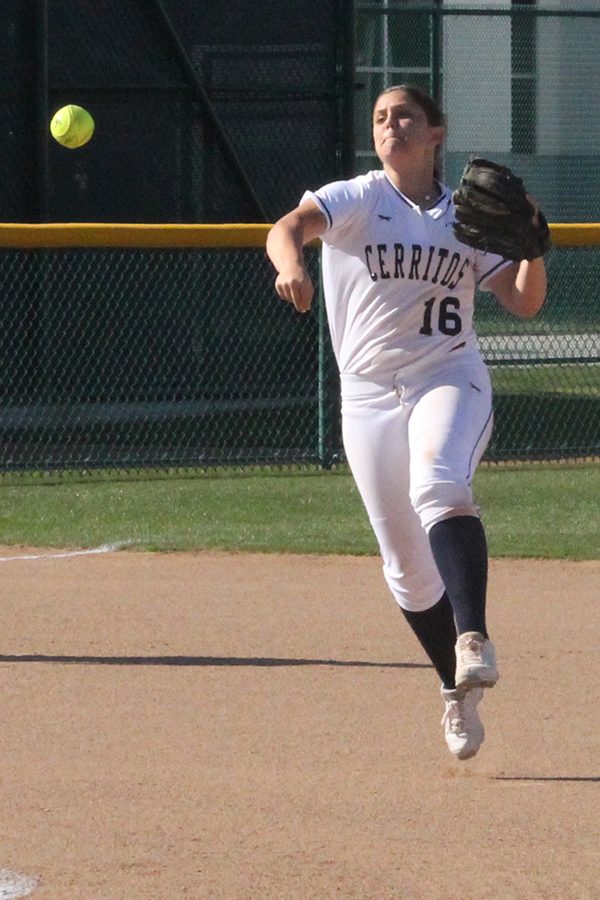 Sophomore infielder Kylee Brown fires a ball to first base for an out during the Falcons game with LA Harbor earlier this season. Brown has started at first base, second base and shortstop throughout the entire season. Photo credit: Max Perez