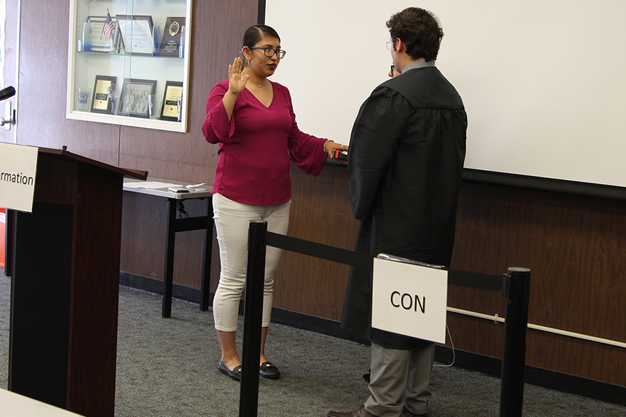 President elect Karen Patron being sworn in in front of ASCC senate by Cheif Justice Rodrigo Quintas on Wednesday, April 26. Her duites as preisdent will begin next Fall semester. Photo credit: David Jenkins