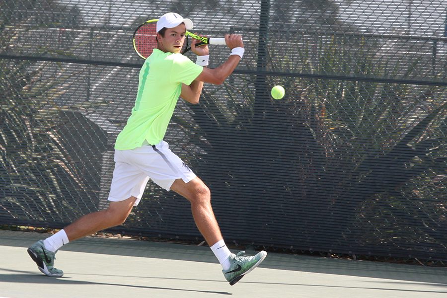 Sophomore Sasha Krasnov winds up to return the ball during his matches Friday at the South Coast Conference Tournament. In his time at Cerritos Krasnov has won back-to-back SCC Player of the Year awards. Photo credit: Max Perez