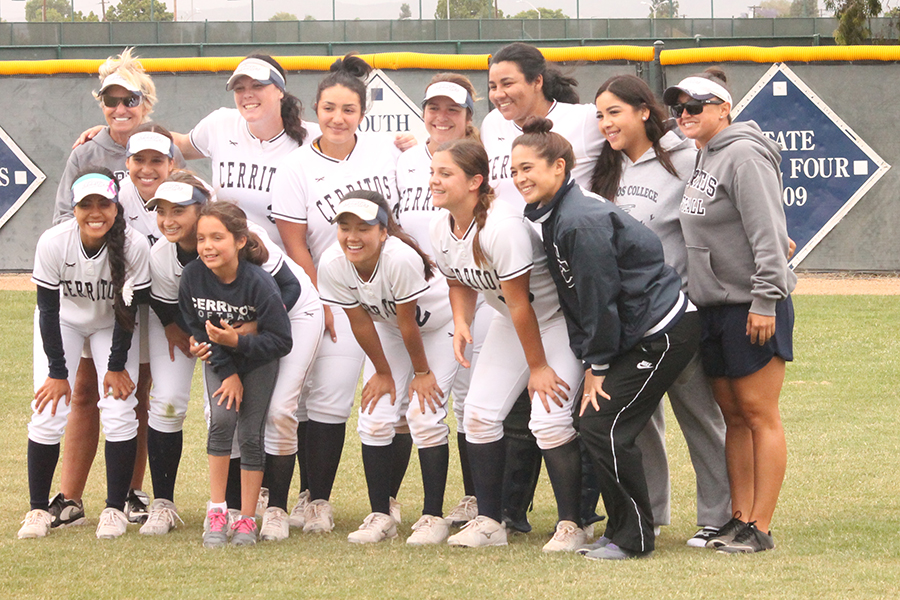 Coach Kodee Murray celebrates with her team and coaches after the Saturday, May 6 victory over Citrus College giving Murray win number 500. Murray is responcible for not only 500 wins but delivering a state championship in 2008. Photo credit: Max Perez