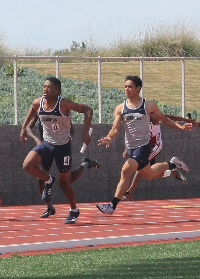 Jaydon Logan (left) head for the finish line after Tyler Coffman (right) hands off the baton during the 4x100-meter men’s relay event at the South Coast Conference championships, Friday. The men would place second in the event with a time of 42.84 seconds. Photo credit: Monique Nethington