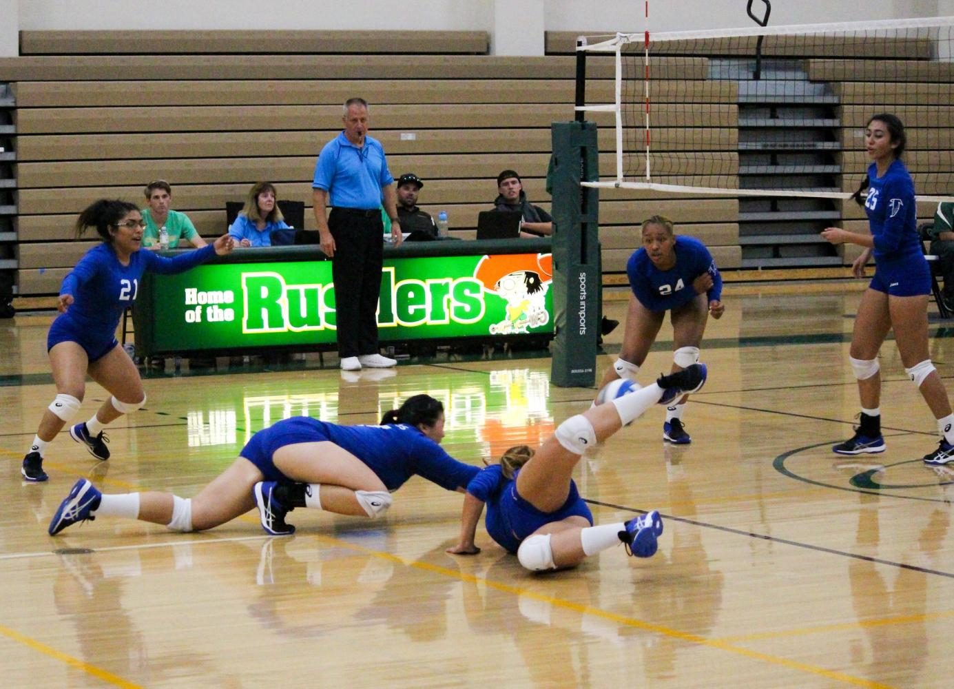 Cerritos College freshman #17 Jody Suski and freshman #4 Nataly Reynoso both dive after a ball during Fridays game against Golden West. The Falcons were swept by the Rustlers in 3 games. Photo credit: Lindsay Helberg