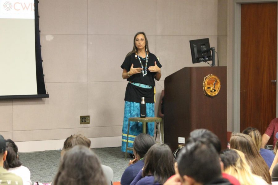 Dina Gilio-Whitaker of the Colville-Confederated Tribes lectures about gender issues and social justice for Native Americans. Being a Native American journalist, Whitaker went to the Standing Rock Indian Reservation to witness the social movement taking place. Photo credit: Scarled Murillo