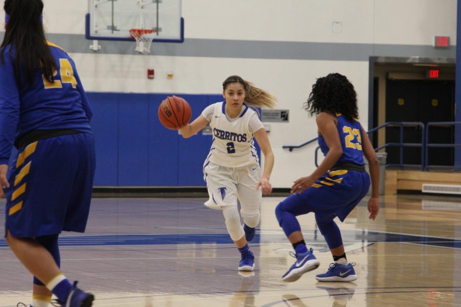 Sophomore, Angie Ferreira No. 2 dribbles past the defending point guard. Ferreira dished out 3 assists.