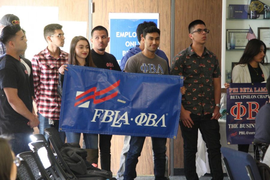 Phi Beta Lambda display their club banners during their presentation to the Associates Students of Cerritos College. They end the presentation by screaming, We are Cerritos.