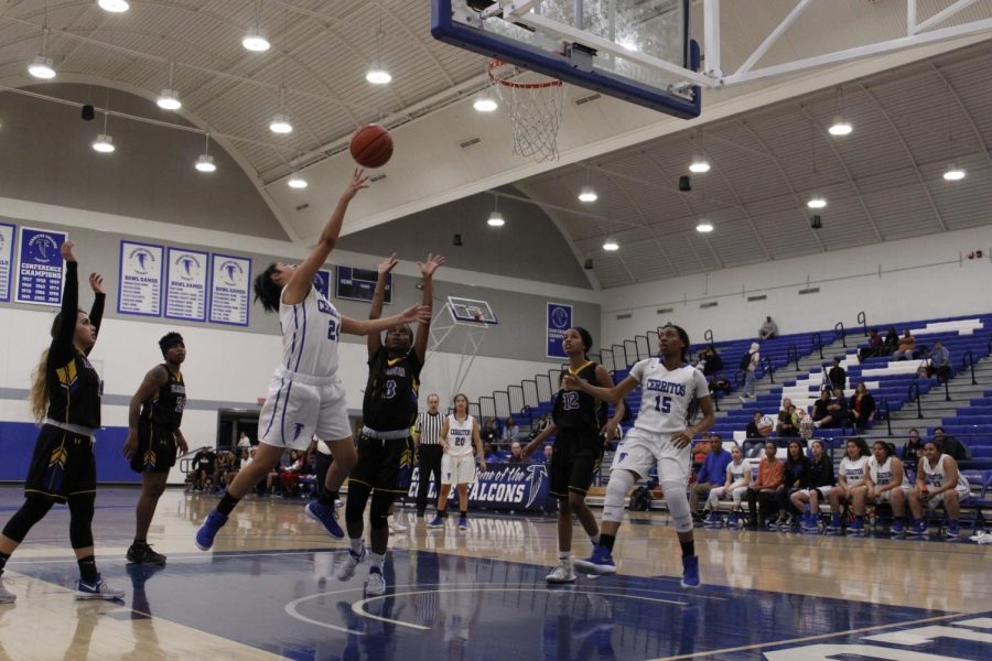 Freshman shooting guard No. 24 Serena Rendon driving to the basket through traffic. Serena had 24 points. 