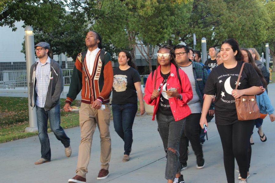 Cerritos College students and professors march around campus for Take Back the Night 2018. Take Back the Night gave students and people alike the opportunity to share their story and bring awareness of sexual assault. 