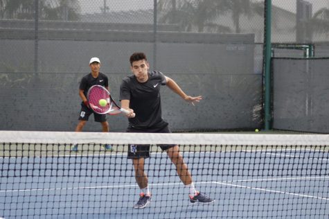 Freshman Dario Rico and his doubles partner sophomore Kwangeun Lee during their doubles match in which was won 8-6. Rico and Lee capped off the 3-0 lead going into the singles. 