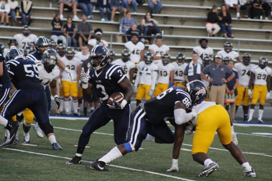 Sophomore running back No. 3 Rhamondre Stevenson, running through the hole created by the Cerritos offensive line. Stevenson ran for 154 yards against College of the Canyons on Sept. 22 at Cerritos College.