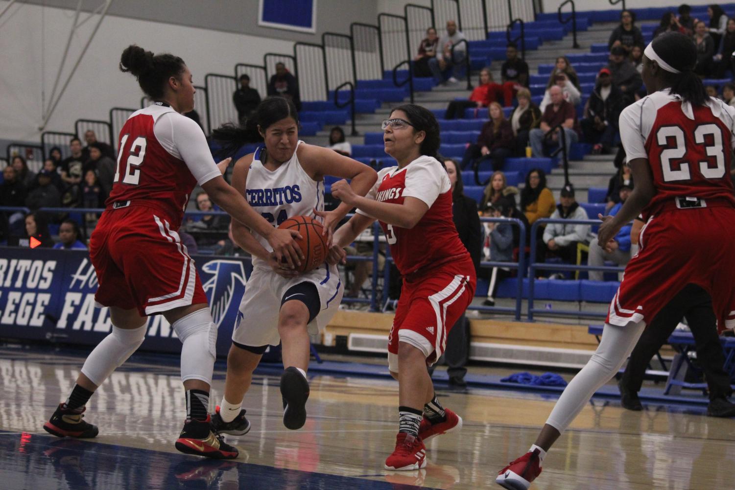 Sophomore guard No. 24 Serena Rendon fighting through the contact to get to the basket. Rendon finished the game with 17 points and seven rebounds in the game at Cerritos College against Long Beach City College on Feb. 8, 2019.