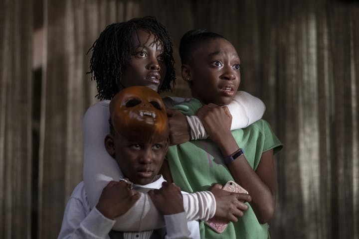 Adelaide (Lupita Nyongo) fights to keep Jason (Evan Alex) and Zora (Shahadi Wright Joseph) safe in Us.