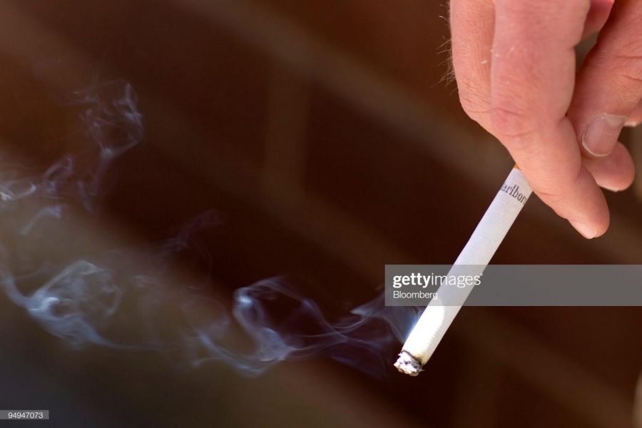 UNITED STATES - APRIL 21: Jonathan Cook smokes a Marlboro 100s cigaratte on the Auraria Higher Education campus in Denver, Colorado, U.S., on Tuesday, April 21, 2009. Altria Group Inc., the largest U.S. tobacco company, said first-quarter profit rose as the top-selling Marlboro brand gained market share, even after the Philip Morris USA division raised cigarette prices three times in four months. 