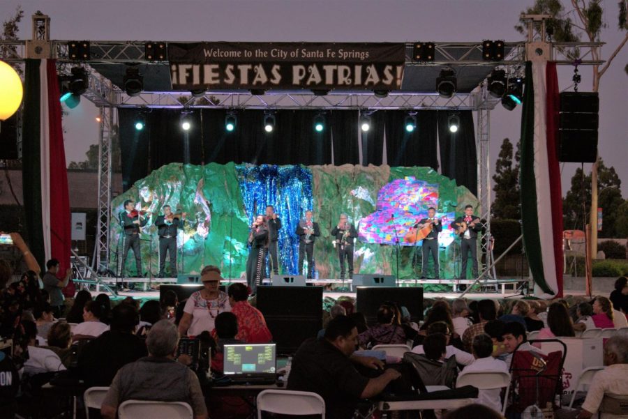 As Fiesta Patrias opens its doors to the public, a mariachi band performs their songs. 