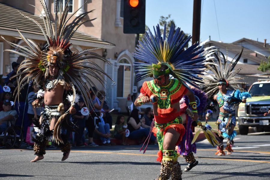 Danza+Azteca+Huehueteotl+perform+on+Norwalk+Boulevard.+They+were+dressed+in+Aztec+attire+and+many+were+barefoot+on+the+hot+street+floor.+