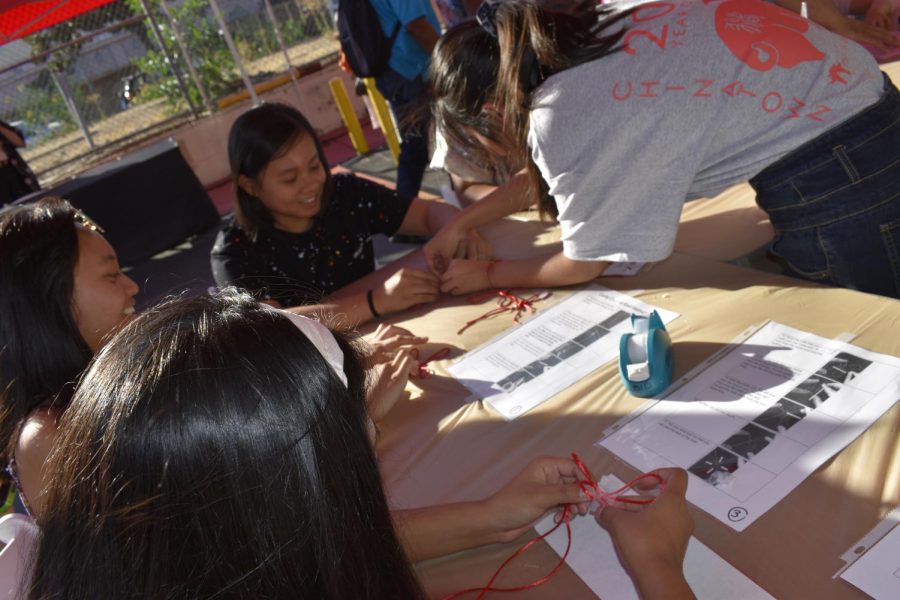 LA Chinatown Mid-Autumn Moon Festival on Sept. 15, 2019. Helen Li is teaching kids to make a Chinese lucky knot.