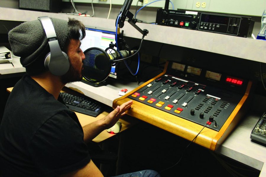 Joshua Negrete, practices his voice recording in the main studio at the WPMD broadcasting studios. Negrete is majoring in both music and business. Photo was taken on Oct. 22, 2019.