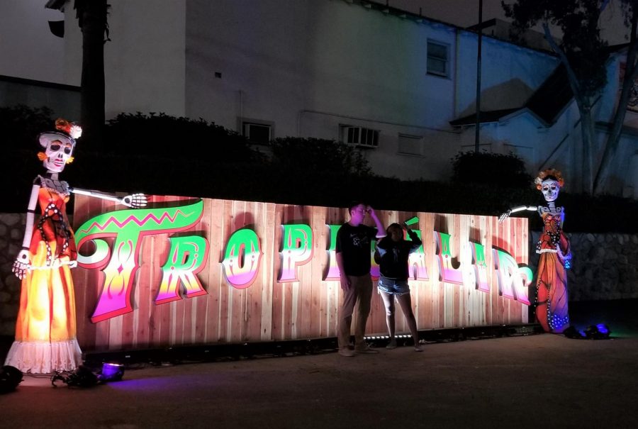 As the night comes to an end, attendees take their last picture by the Tropicalia sign. The sign consisted of Day of the Dead figures and bright lights. 