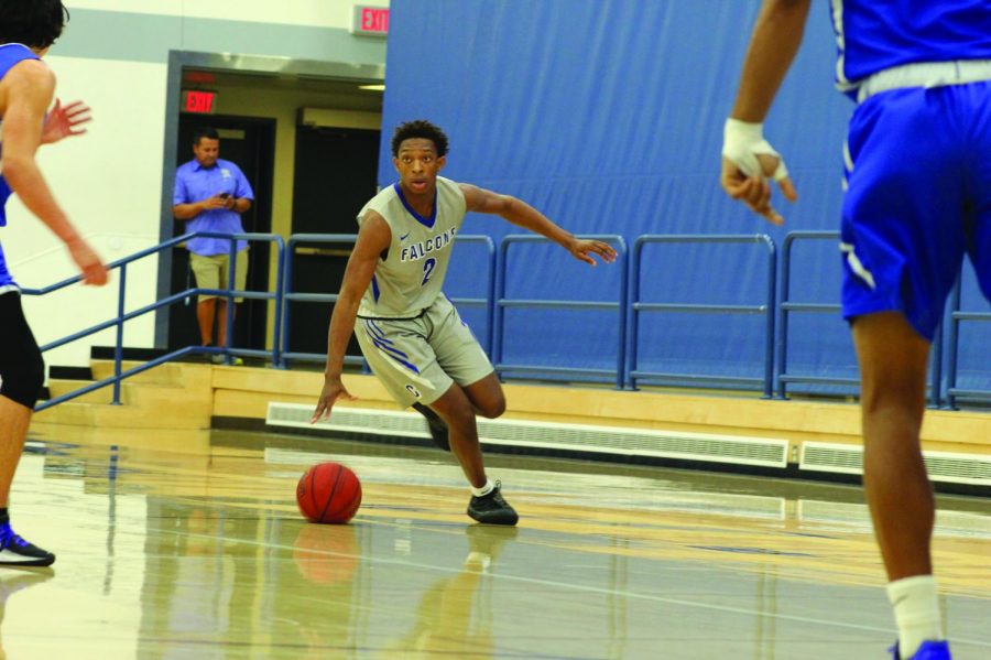 Down the Court: sophomore point guard Joshua Belvin dribbles the ball to the basket against Santa Monica College. The Falcons lost 71-61 on Nov. 22, 2019 