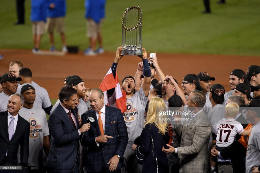 LOS ANGELES, CA - NOVEMBER 01: Carlos Correa #1 of the Houston Astros hoists the Commissioner's Trophy after defeating the Los Angeles Dodgers 5-1 in game seven to win the 2017 World Series at Dodger Stadium on November 1, 2017 in Los Angeles, California.