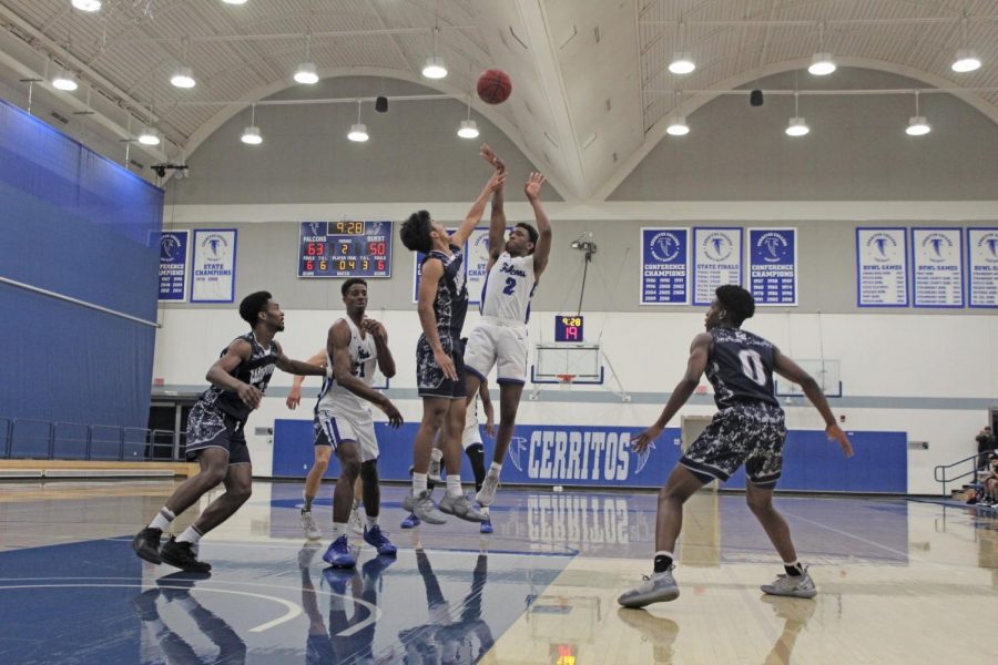 Freshman+point+guard+No.2+Joshua+Belvin+hits+a+step+back+jumper+against+a+an+El+Camino+defender.+Cerritos+played+El+Camino+on+Friday+Feb.14.+Photo+credit%3A+Keanu+Ruffo