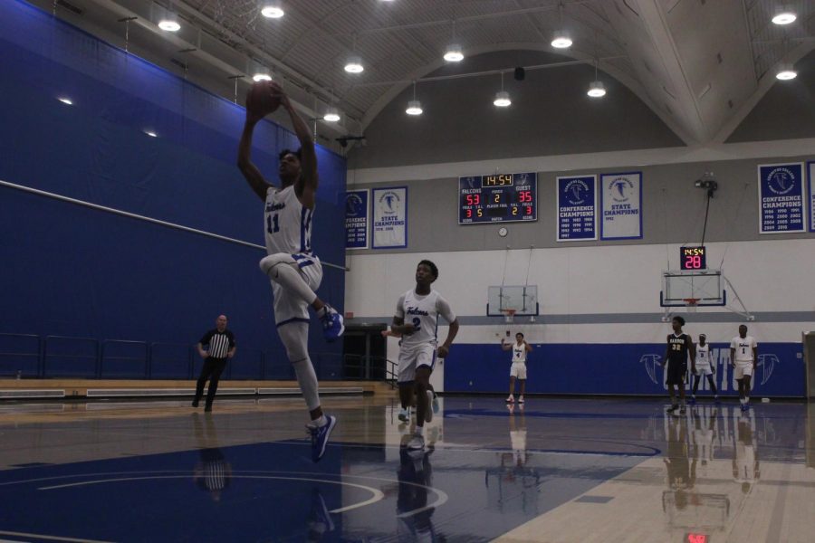 Falcons forward No. 11, Jaishon Forte, steals the ball from a Cougar player and dunks it at the end of the play. Cerritos men's basketball played LA Harbor college on Feb.7, 2020. Photo credit: Keanu Ruffo