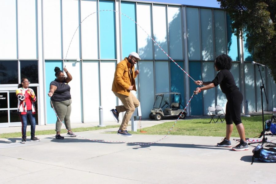 English Professor, Damon Cagnolatti (jumping rope) participates in the Playground celebration Back to the School Yard: Lets Double Dutch. Where a double dutch tutorial takes place at Falcon square amphitheater on February 6, as part of the schools Black History Month celebration. 