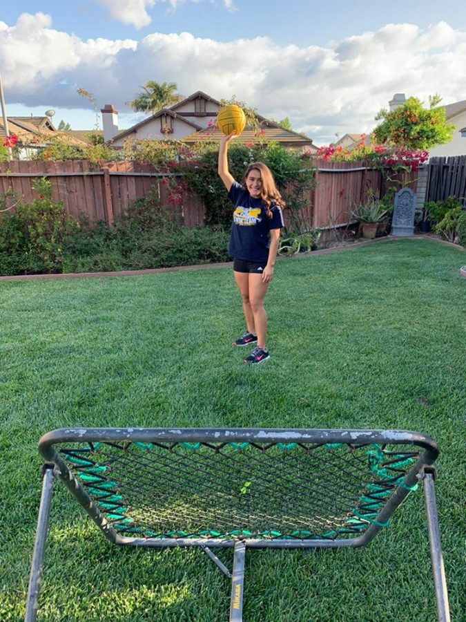 Mia Carbajal shows her backyard set up to practice water polo drills at home.