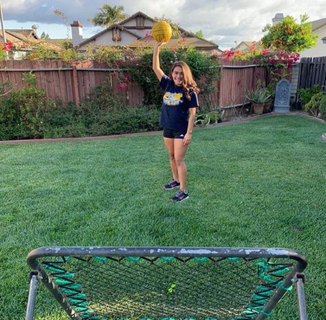 Mia Carbajal shows her backyard set up to practice water polo drills at home.