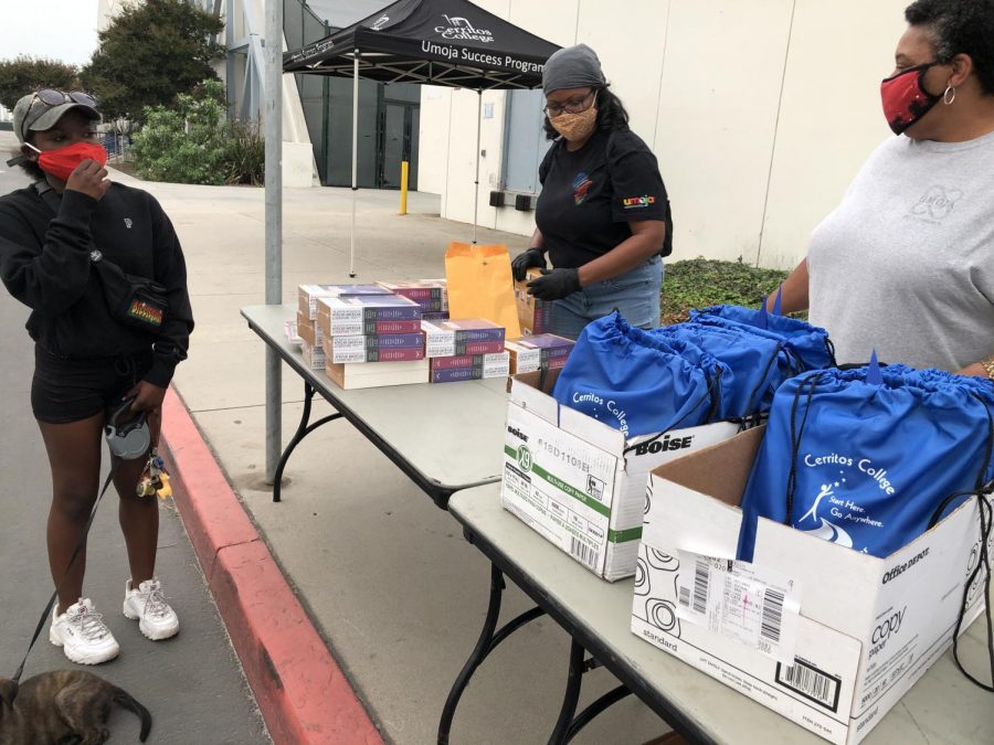 The Umoja Success Program prepares a college student care-package filled with a binder, notebook and miscellaneous school supplies on Sept. 10. Photo credit: Daniel Suarez Jr.