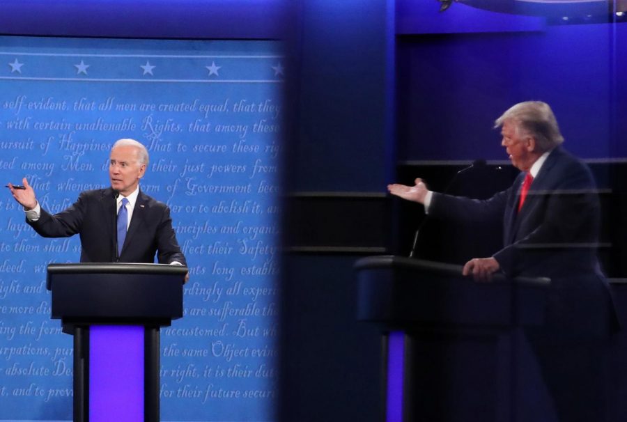 Democratic presidential nominee Joe Biden and U.S. President Donald Trump, shown in a reflection, participate in the final presidential debate at Belmont University on October 22, 2020 in Nashville, Tennessee. This is the last debate between the two candidates before the election on November 3. 
