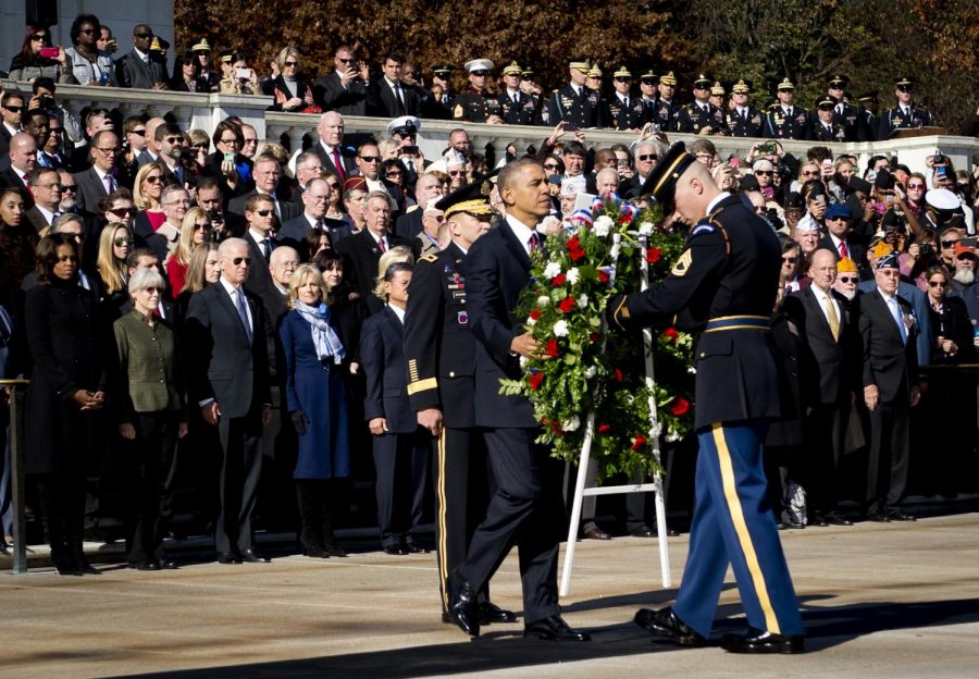 President Barack Obama sets a commemorative wreath  at the 