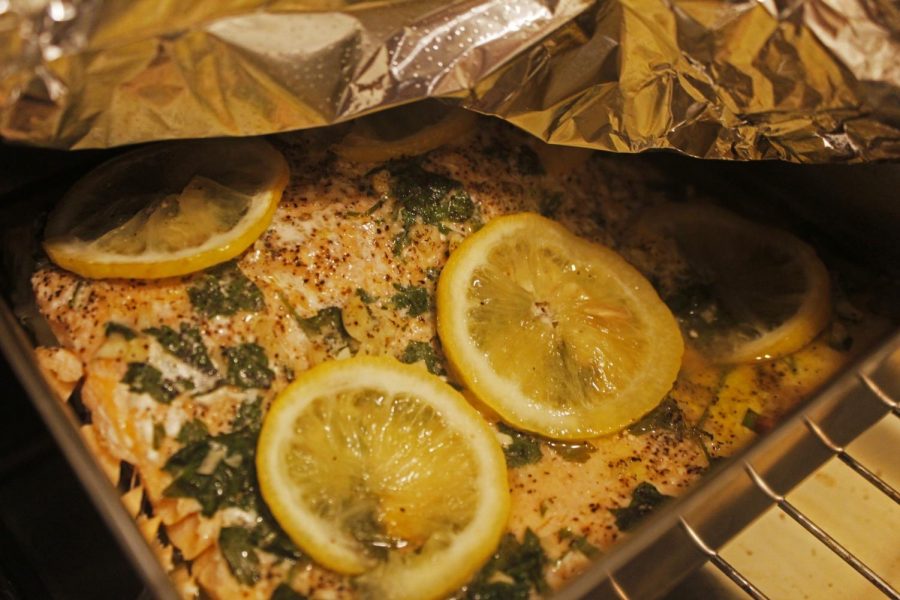 Lemon slices are the key ingredient in making a delicious flavorful baked salmon dish. Simple ingredients yet bold piquancy. Photo credit: Rebecca Aguila