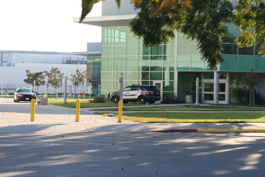 Campus police congregate on the north side of campus by the liberal arts building on Dec. 5, 2020. The college reported ten cases in the month of December.