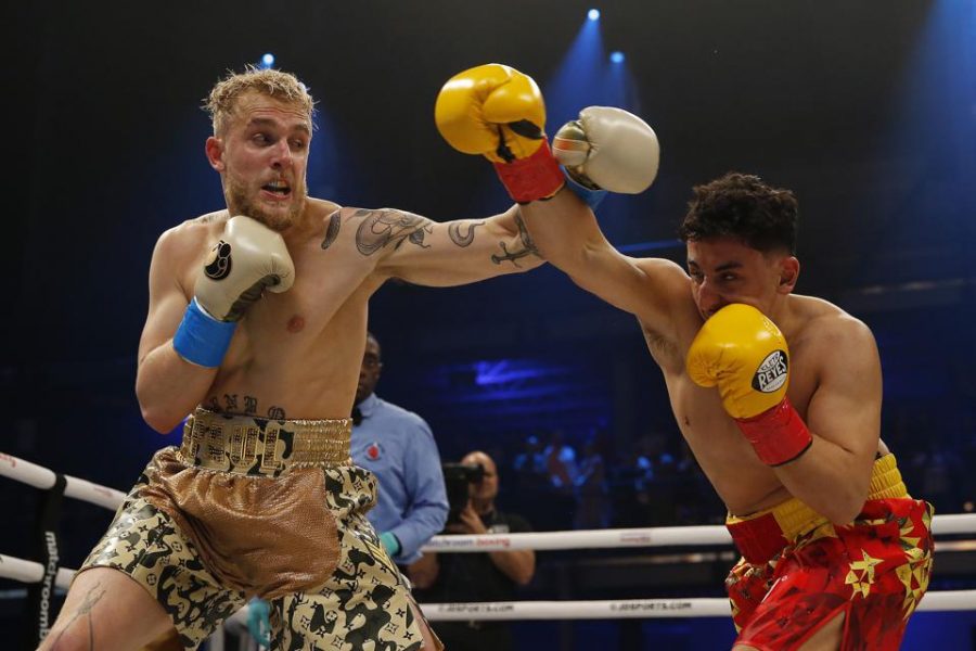 Jake Paul and AnEsonGib exchange blows during a boxing match in January. YouTubers are finding new ways like boxing to gain clout and boost their popularity in the entertainment world. Photo credit: Michael Reaves/ Getty Images