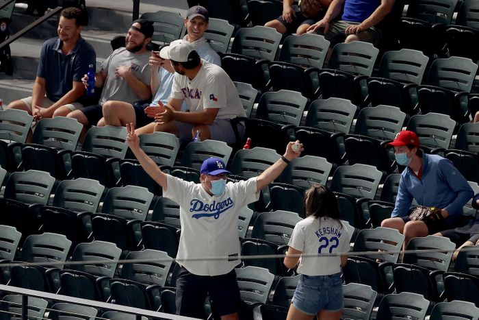 A+Los+Angeles+Dodgers+fan+celebrates+catching+a+foul+ball+during+game+one+of+the+National+League+Championship+Series+between+the+Dodgers+and+the+Atlanta+Braves.+Photo+credit%3A+Ron+Jenkins