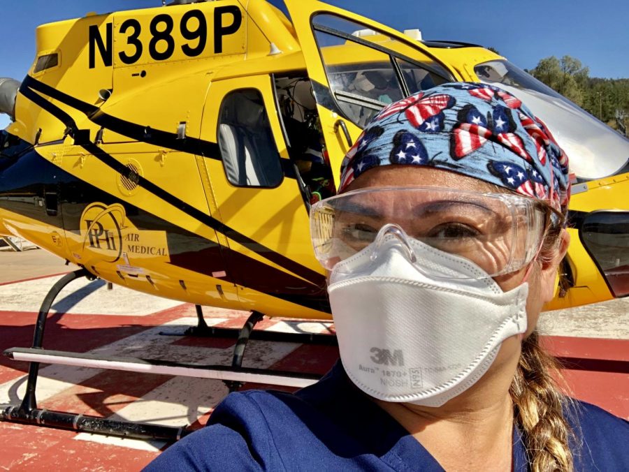 Registered Nurse Ana Valdoria, wears a mask as she arrives at White River, Arizona on Aug. 14. Valdoria was deployed to assist with the Apache Tribe and Navajo Nation COVID-19 patients. 