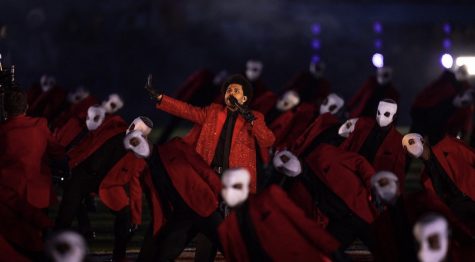 The Weeknd alongside a group of backup dancers on the Raymond James Stadium filed during the halftime performance. Photo credit: The Weekend