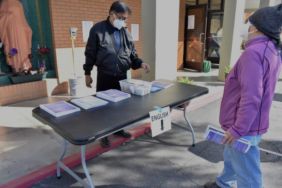 Volunteer at Saint John of God Church, Ed Santos, distributed ashes to the churchs congregation on Ash Wednesday. The church held an indoor mass on Feb. 17, 2021.