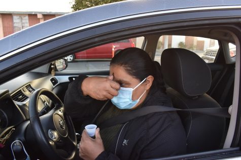 Maria Cardenas received her ashes at Saint Domonic Savio Church on Ash Wednesday. The church held a drive-through ash distribution on Feb. 17, 2021.