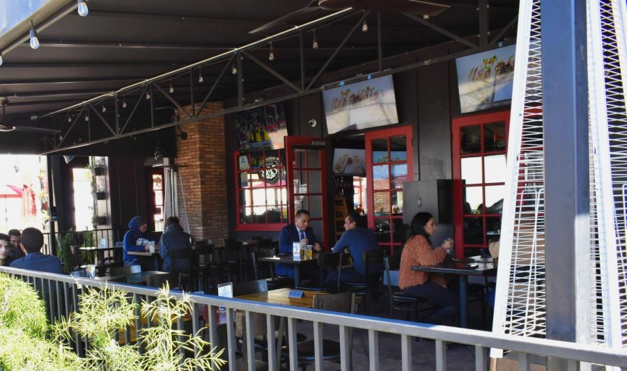 Customers enjoy an outdoor meal at Fronk's bar and restaurant on Feb. 5. Fronk's has observed safety restrictions since they were implemented. 