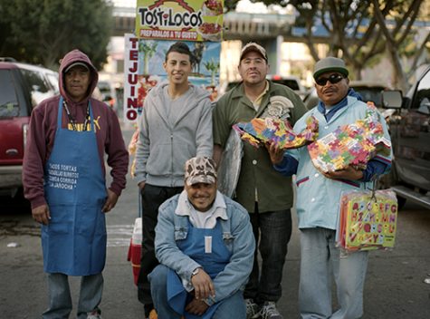 A photograph from Ortizs project Todos Somos Familia. Pictured are some of the vendors that did business in Tijuana, and Ortiz noted that many of them shared a familial bond.