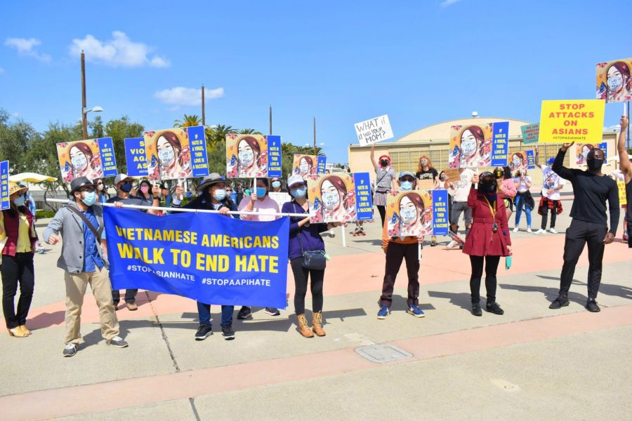 Dozens attended the Skate to End Hate protest in Irvine on March 20, 2021. While most skated or rode bikes, some supporters marched and carried banners with messages of unity.